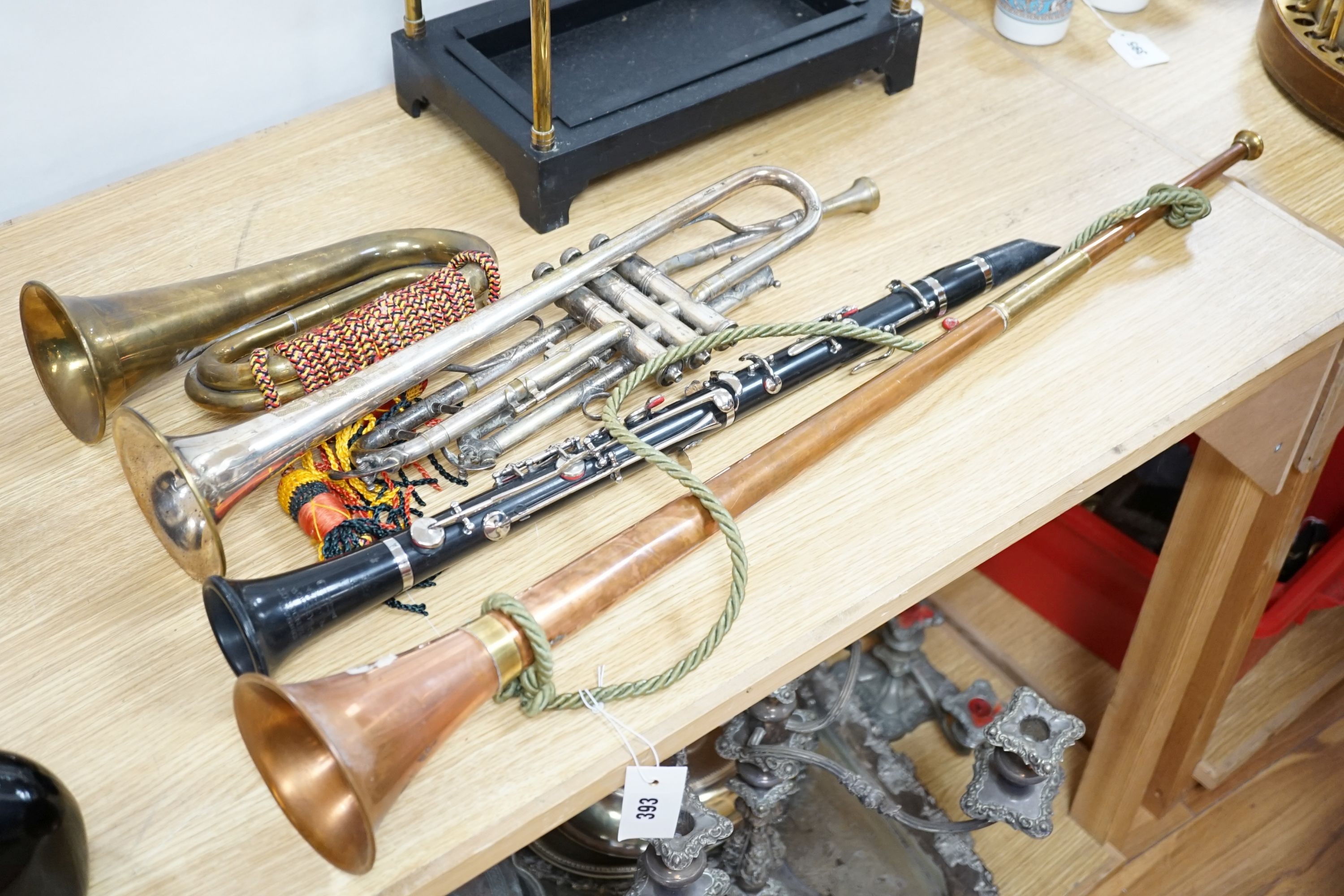 A Boosey and co Clarinet H.75983, plated trumpet, brass bugle and a copper hunting horn 87cm